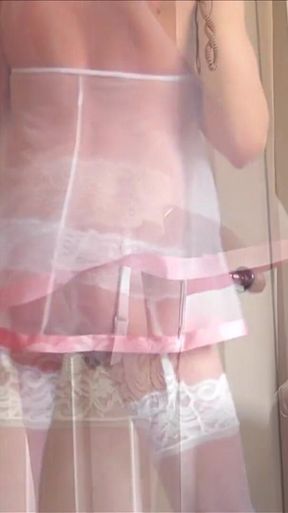 Clips in white lace stockings and sheer babydoll