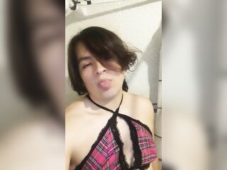 Femboy hits his face with a dildo