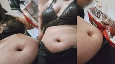 Chub girl eating chips next to chritsmas tree