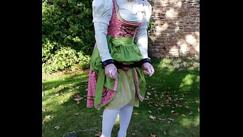 Bavarian Dirndl Girl with testicle pillory