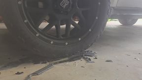 Chrissy running over car with her big truck