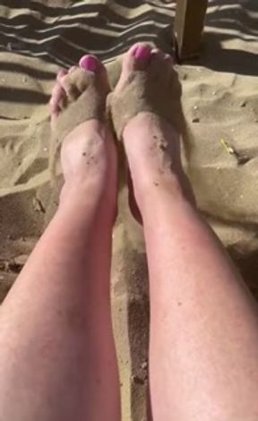 bare feet on a sandy beach