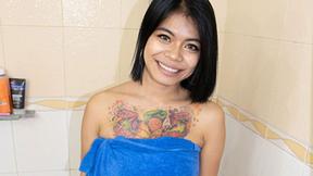 ”BIG-TITTED THAI BIMBO WASHES HER BIG JUICY UDDERS”