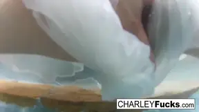 Brunette Charley masturbates and shows off her huge boobs