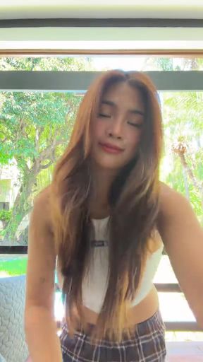 Slim blonde Filipina celebrity babe poses in a solo photoshoot