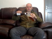 Kudoslong strips and masturbates till he cums with a beer bottle up his anus