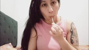 Sucking lollipop on tits