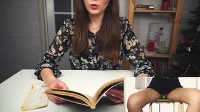 reading a book while sitting on a vibrator. literary orgasm