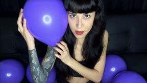 Having fun with purple balloons