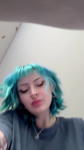 Goth babe shows off her big boobs and ass