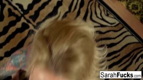 Blonde bombshell Sarah Jessie takes off her top to reveal her big natural tits