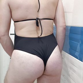 Crossdresser wearing Black one piece swimsuit