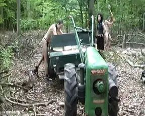 Dark haired German lady making her slaves chop wood