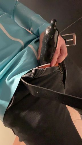 With black latex cocksheath