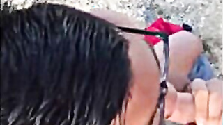 Blowing Manstick on the Beach