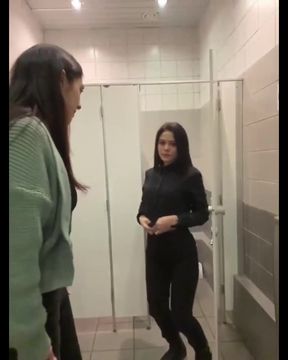 Curvy couple shares a steamy kiss in the toilet stall