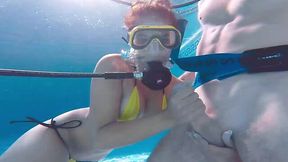 Sexy diver tries to insert a dick into her pussy right under the water.