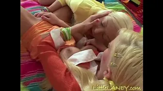 Two blondes passionately kiss and rub each other's wet pussies