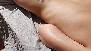 Sunbathing naked on public balcony