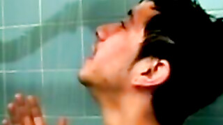 Amateur tattooed twink with a tan showers in classics porn