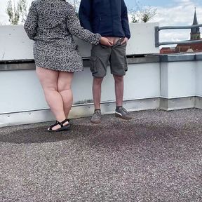 Gorgeous pissing mother-in-law helps son-in-law piss on the top of the parking lot