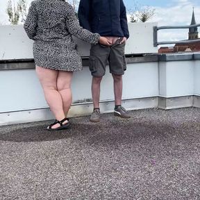 Gorgeous pissing mother-in-law helps son-in-law piss on the top of the parking lot