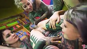 Tattooed girl gets her ass filled with cum, compliment of goth lesbians