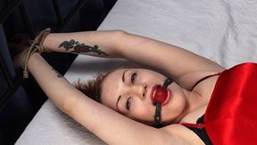 Ballgagged barefoot Amanda in red dress, bound on the bed with her hands tied to the headboard and with her feet tied to the footboard, is tickled by a man (HD MOV)