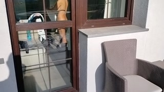 I spy on my neighbor and play with my cock.  She opens the door and starts playing with his cock too