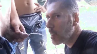 Older man gets outdoor blowjob and piss play from younger guy