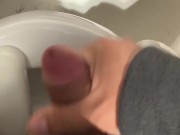 I jerk off in a public bathroom while someone pisses in the stall next to me