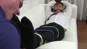 Bound hunk endures feet licking and toe sucking from master