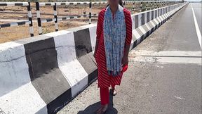 Standing on the bridge of Komal Highway to get touched by the driver