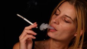 Sexy blond Eve smokes long cigarette with huge ash and pleasure