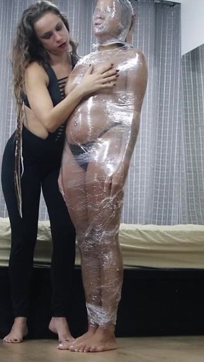 Luana Mummified with Plastic Wrap