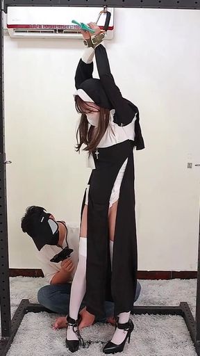 The Girlfriend Role-plays a Nun, Handcuffed and Shackled, Bound to an Iron Frame
