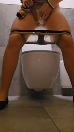Public toilet pissing in Tights and beautiful dress
