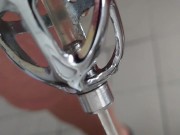 Piss in the penis cage with catheter in tights