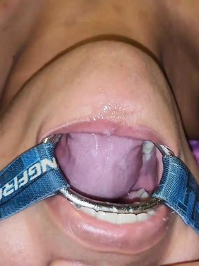Putting It in Her Pussy and Then Straight Into Her Mouth with a Spider Gag in Her Open Mouth