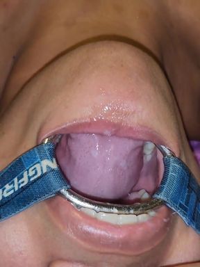Putting It in Her Pussy and Then Straight Into Her Mouth with a Spider Gag in Her Open Mouth