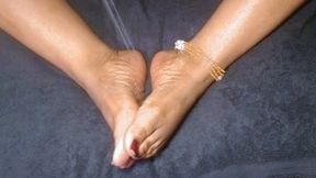 Oiling Ebony Feet With Dark Red Toes