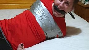 Miss M with a completely helpless man duct taped tight on bed in leggings