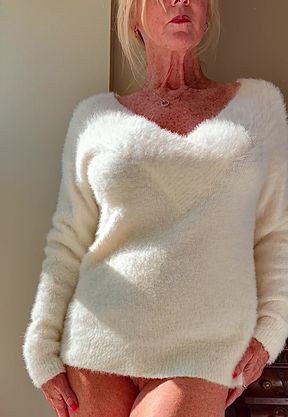 Sexy Blonde Woman in White Sweater