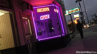 Bearded white man sucking and fucking a black cock at a gloryhole