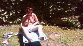 Nicoletta Sunbathes in a Garden Wearing a Big Dirty Diaper