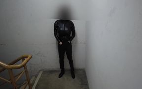 Latex bodysuit dude chokes on his own cum on staircase
