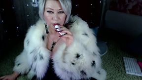 A lovely mature bitch flirts in a fur coat, and then gives us frantic masturbation with squirting!