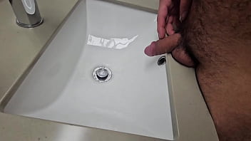 Hairy gay pissing in sink