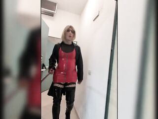 Public walk in overknee boots in a parkhouse, clothed in nylons, red pvc suit and leather coat. Sexy blond.