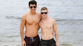 ”Gay men having fun by the shore then in the hotel room”